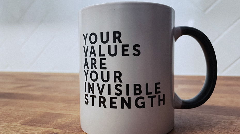 The Mx Group coffee mug displaying the phrase, "your values are your invisible strength."