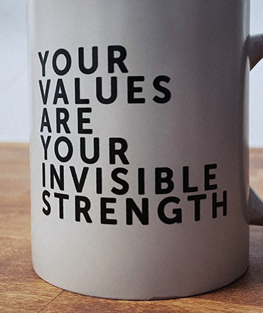 The Mx Group coffee mug displaying the phrase, "your values are your invisible strength."